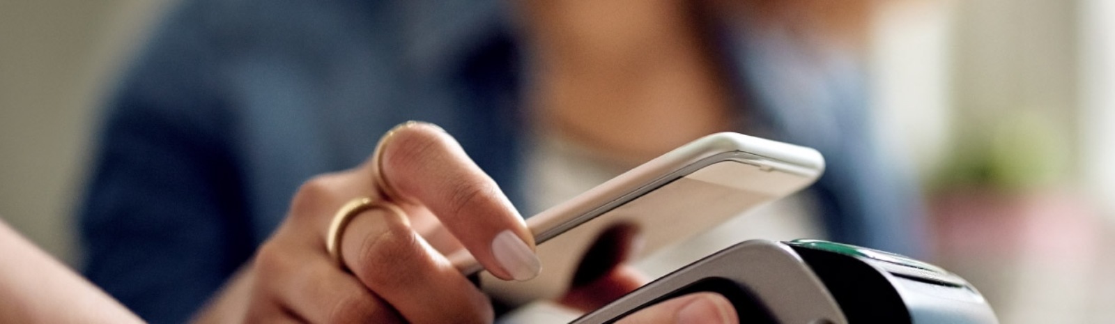 a person making a purchase using their mobile phone